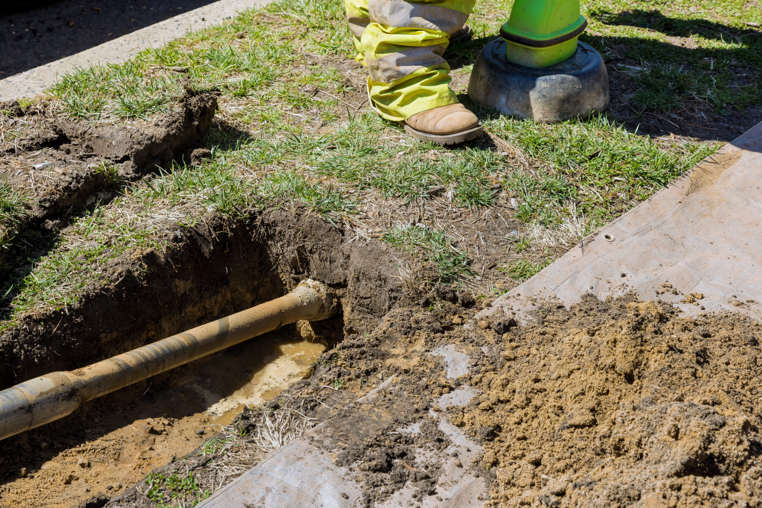 Irrigation pipe and valves being installed in an open trench